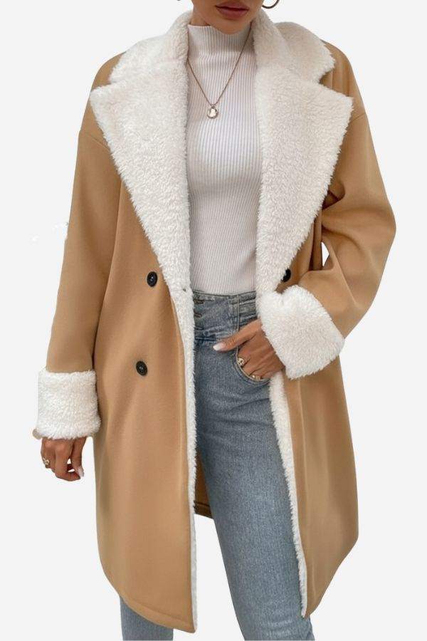Women wearing Nordic Warmth shearling-lined camel coat with white faux shearling trim and double-breasted buttons over white turtleneck and jeans