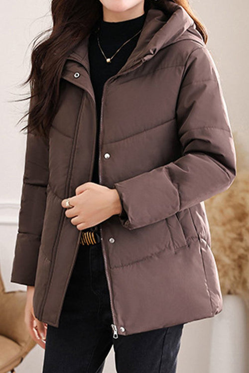woman wearing brown mid-length Everyday Warmth Coat with hood and zip-up front