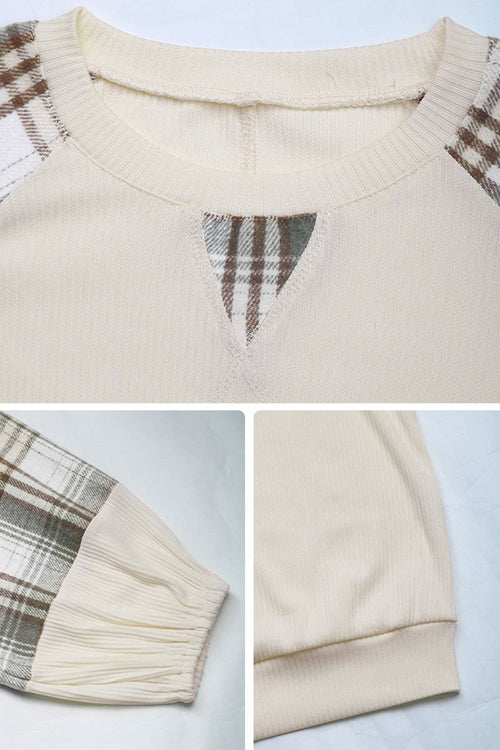 Cream waffle knit sweatshirt with plaid sleeves and v-notch neckline detail close-up shots