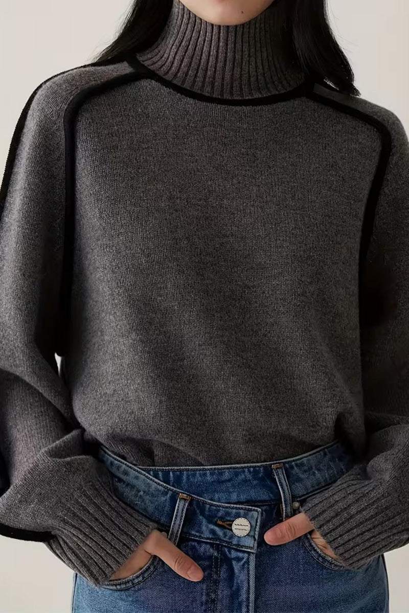 Dark gray Zero Itch Turtleneck Sweater with slimming contrast trim and relaxed fit worn with jeans