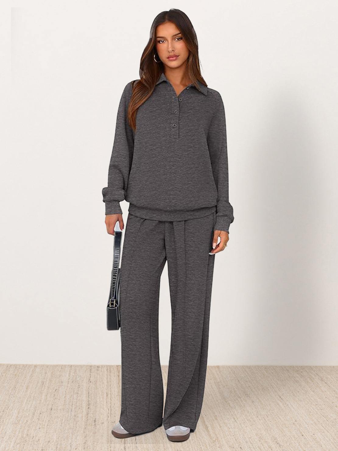 Woman wearing a wrinkle-free polo set with quarter-button top and high-waisted pants in a casual, structured outfit