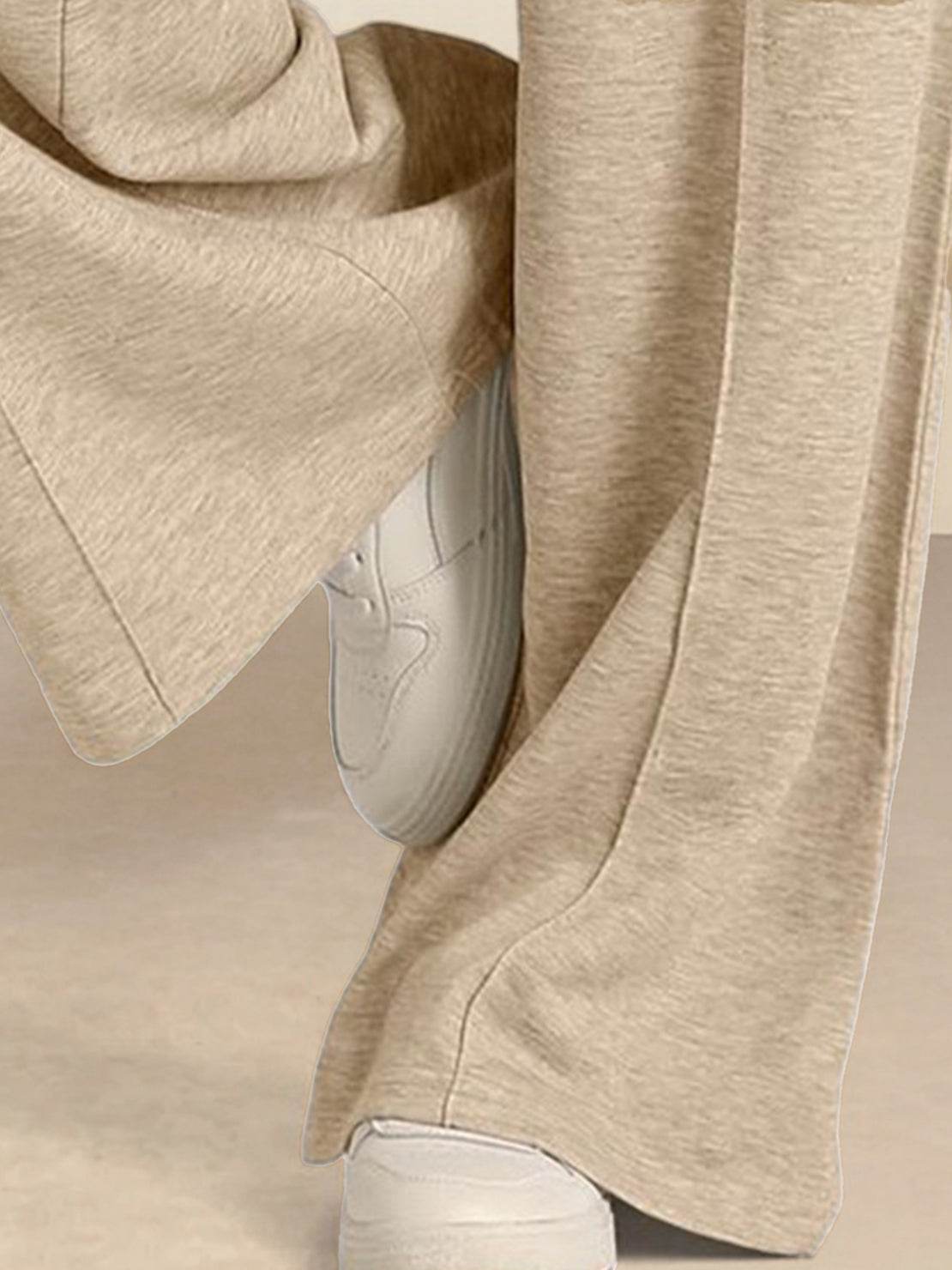 Soft knit wide-leg pants with breathable fabric, elastic drawstring waist, and functional pockets for a relaxed everyday fit