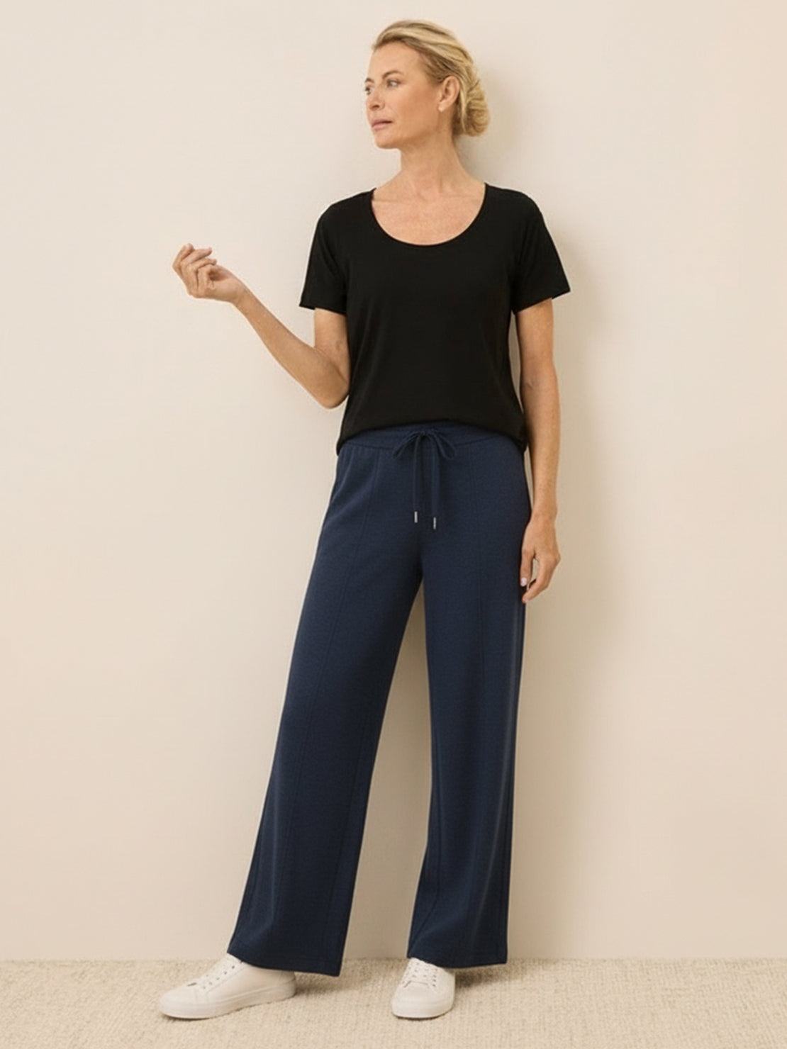 Soft knit wide-leg pants in breathable fabric with elastic drawstring waist and side pockets
