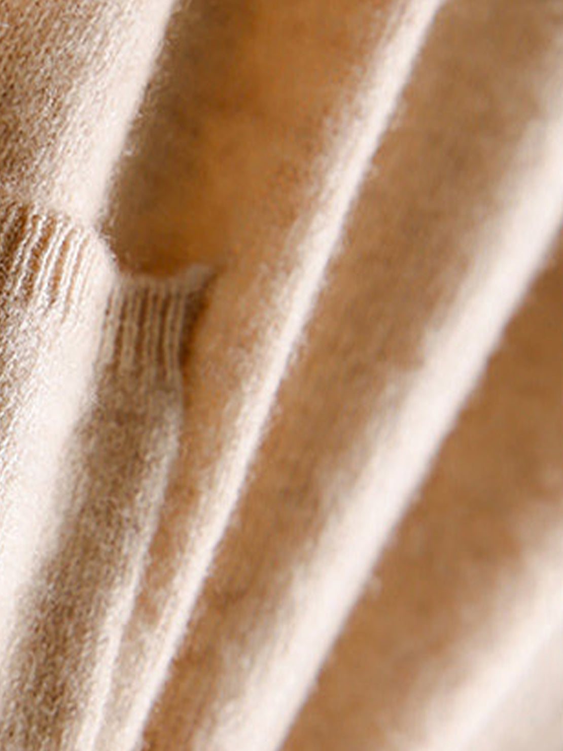 Long 100% Australian Merino Wool cardigan with open front and pockets, ideal for layering and natural temperature regulation.