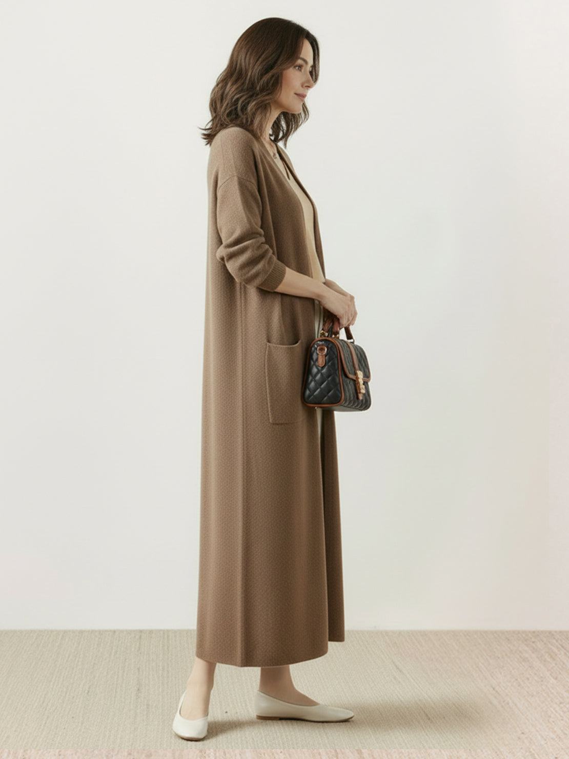 Long Australian Merino Wool cardigan with open front and patch pockets, ideal for layering and natural temperature regulation