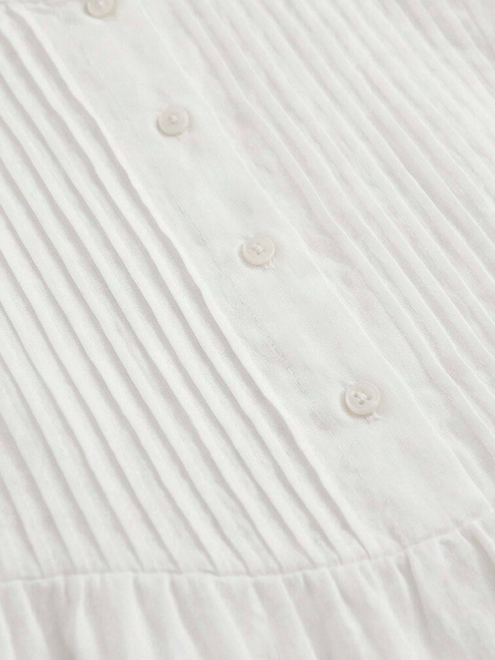 Sleeveless cotton linen pleated midi dress with round neckline and empire waist