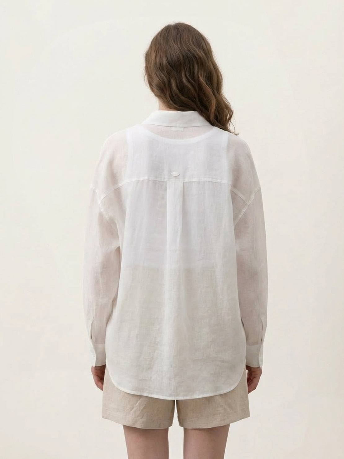 Lightweight 100% linen sheer overshirt with relaxed fit and button front