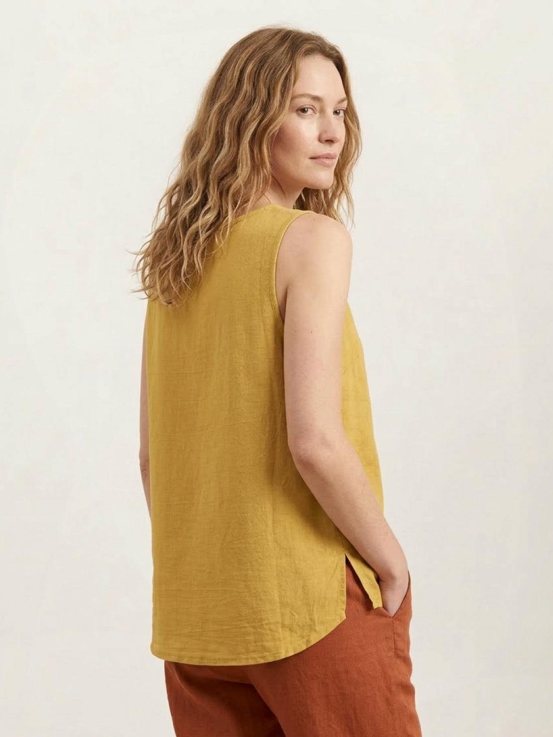Loose fit sleeveless cotton linen top with curved hem and chest pocket detail