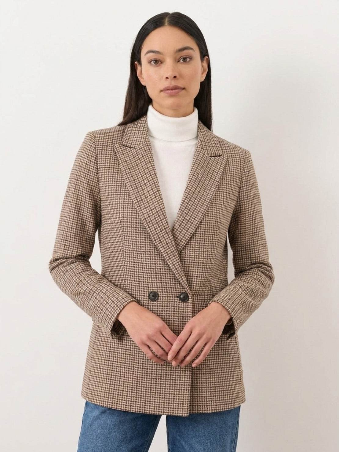Black and white houndstooth commuter blazer with structured shoulders and relaxed fit