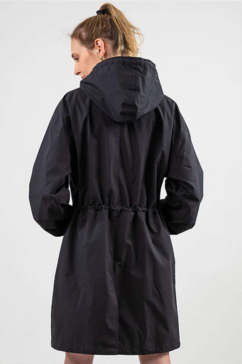 Black water resistant oversized windbreaker with hood, back view, long fit, adjustable waist for women