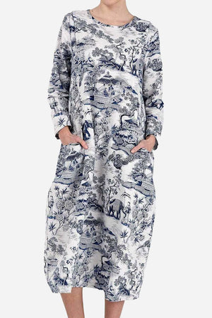 Japanese porcelain print midi dress with blue motif, rounded neckline, 3/4 sleeves, and two front pockets in loose fit design