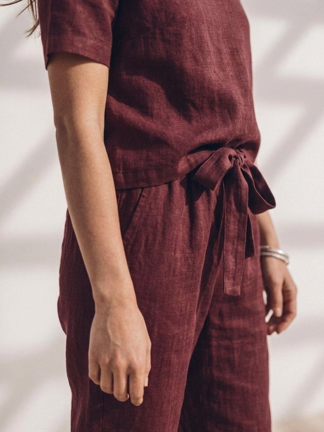 Cotton-linen set featuring relaxed short-sleeve top and straight-leg pants in breathable soft fabric with natural texture and monochrome palette