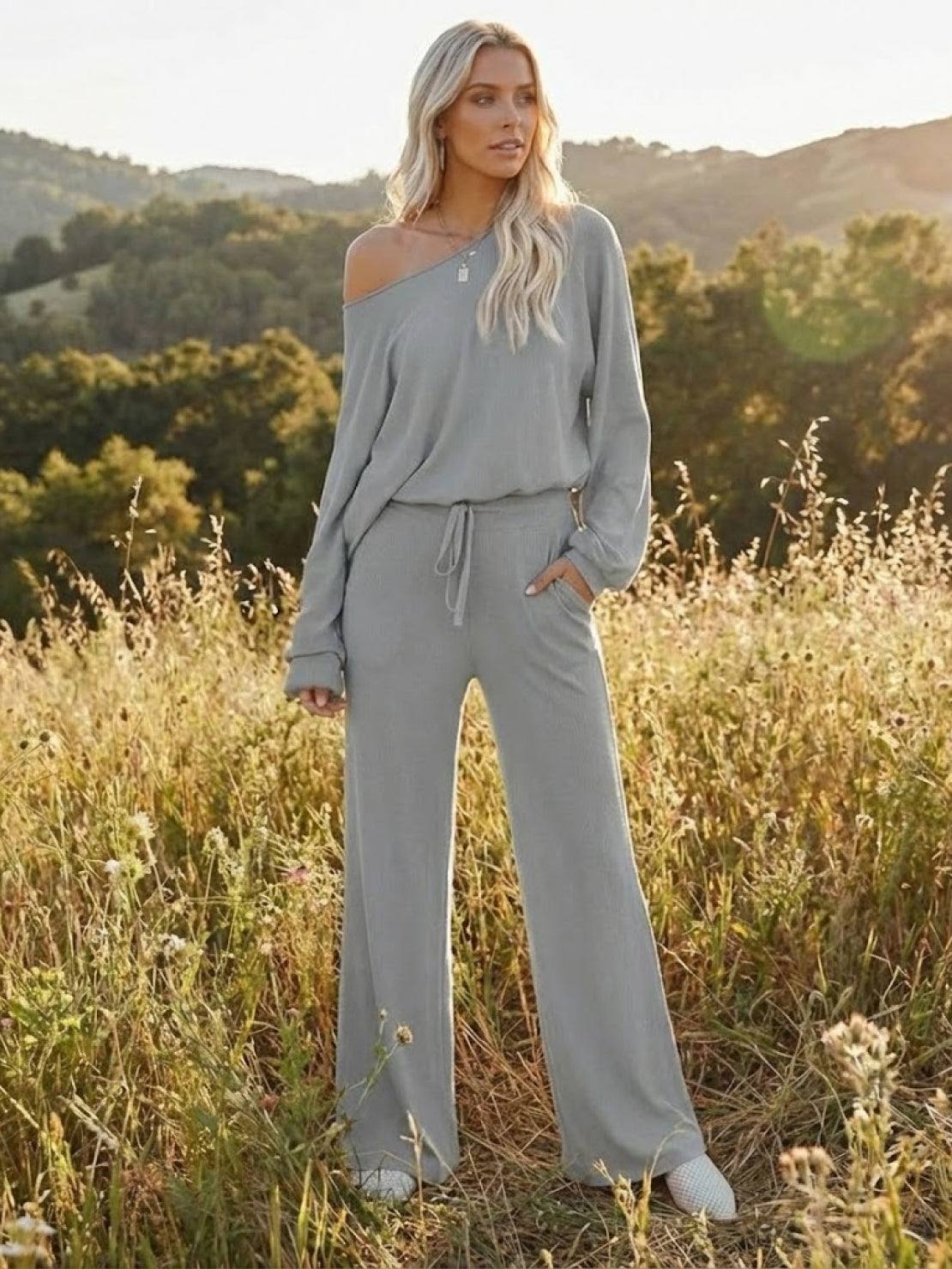 woman wearing gray round neck loose fit cozy two-piece set with wide-leg pants outdoors in field