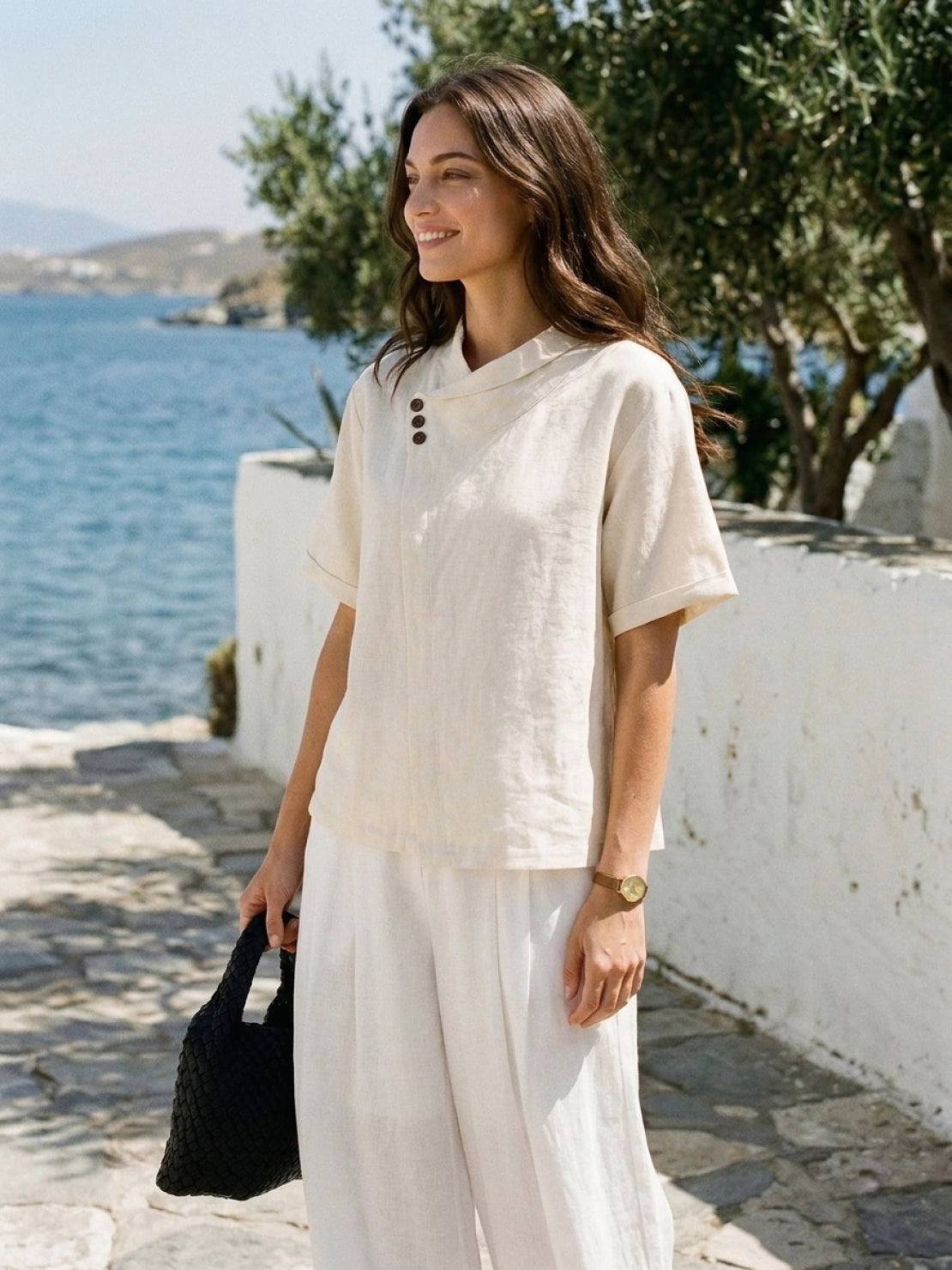 100% linen relaxed V-neck top with asymmetric button detail and short sleeves in breathable fabric