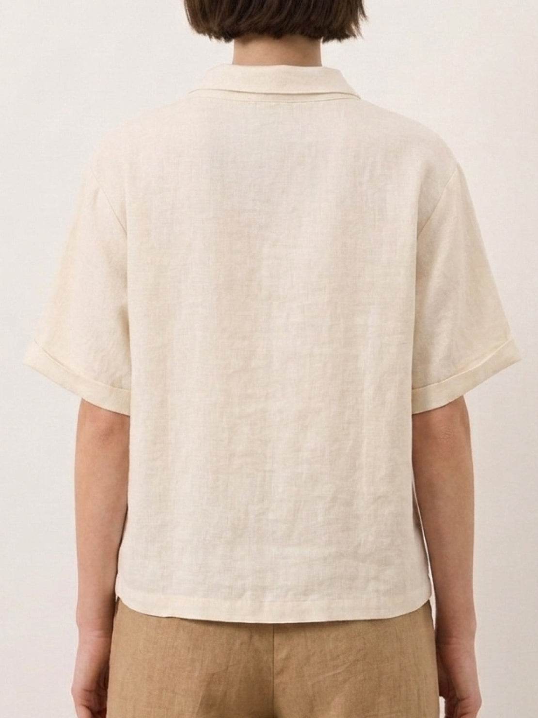 100% linen relaxed V-neck top with asymmetric button detail in navy blue