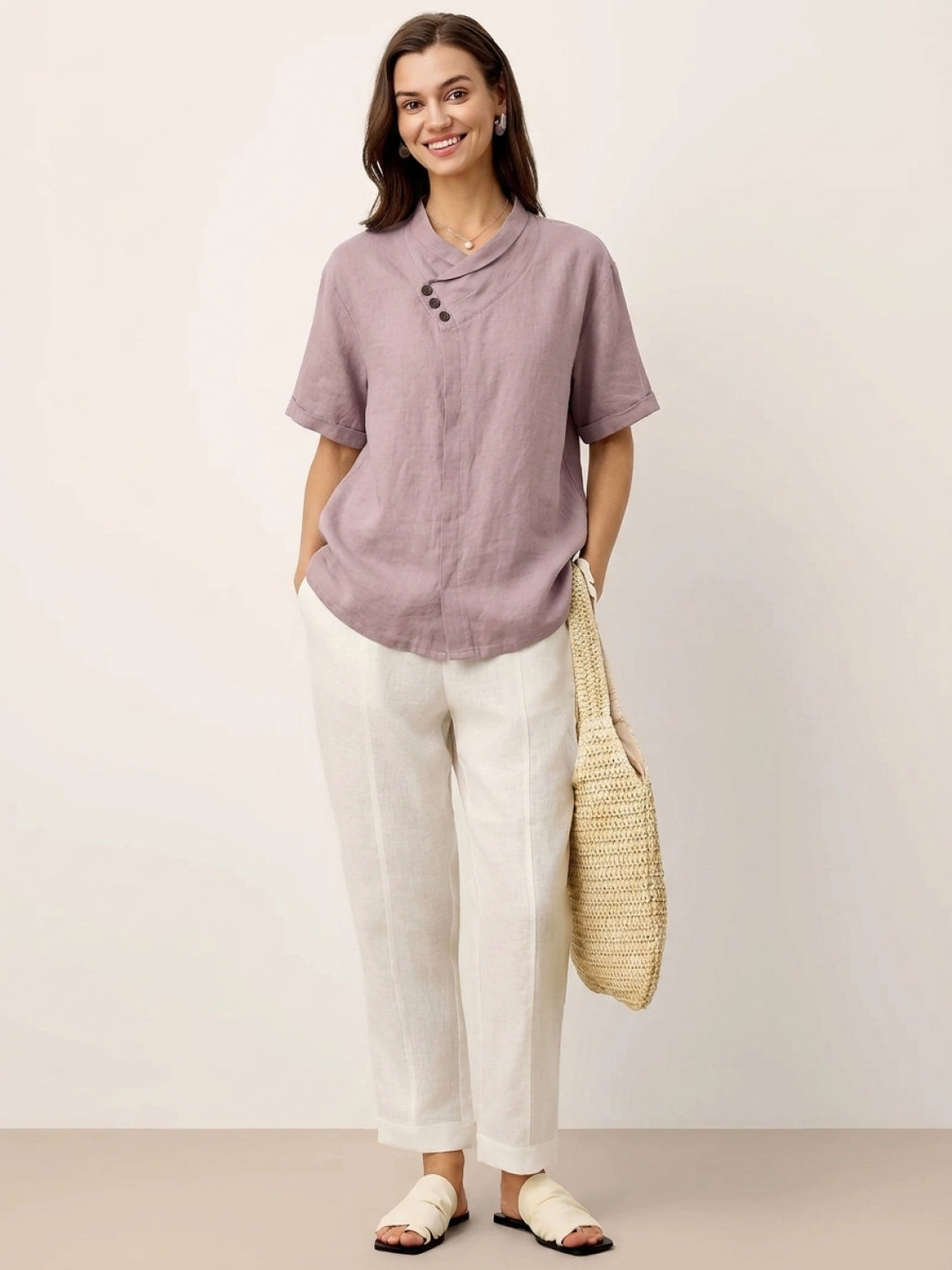 White 100% linen top with relaxed fit and asymmetric button detail