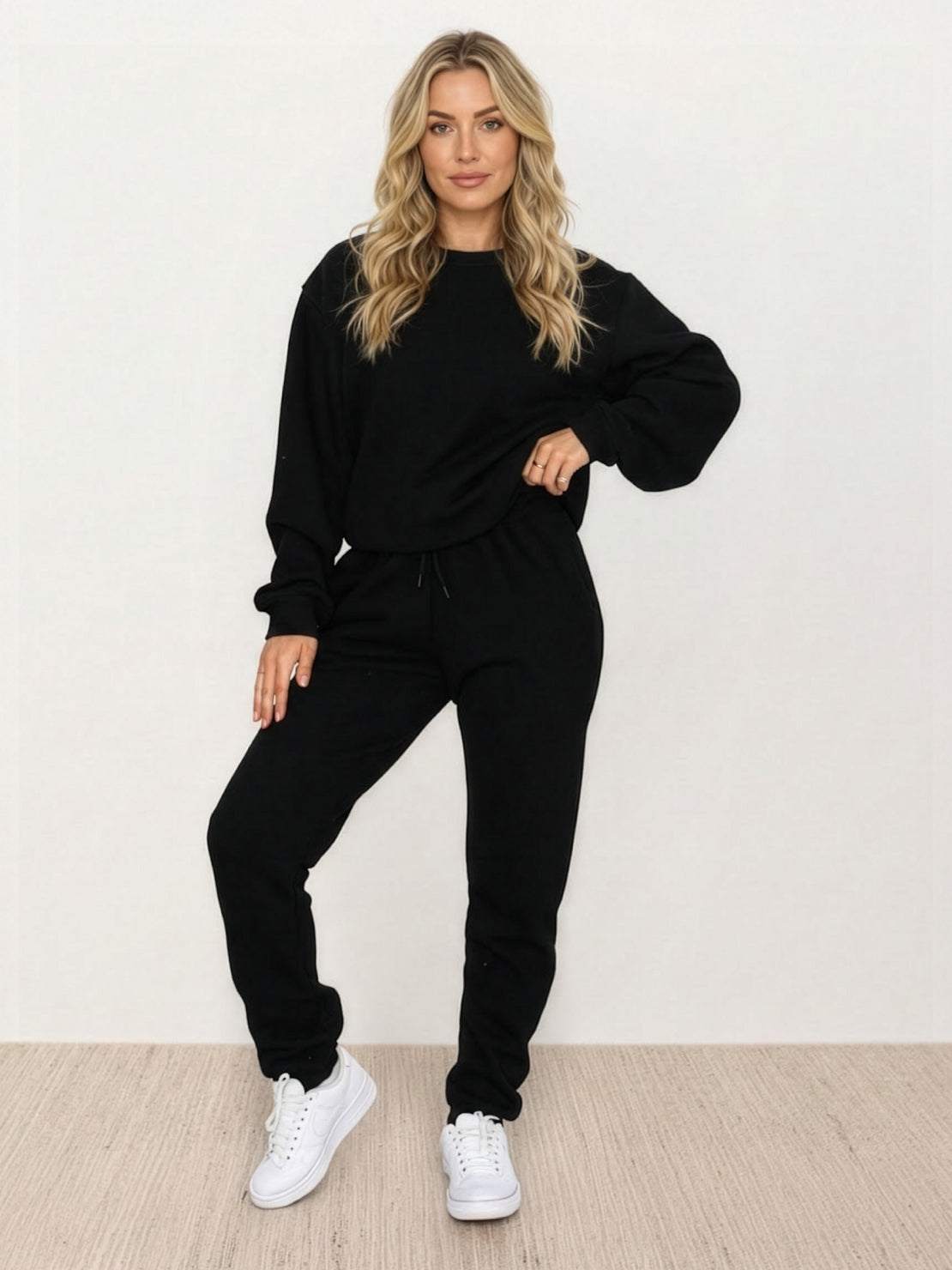 Woman wearing Classic Comfort Athleisure set in grey stretchy fabric, showcasing comfortable and flattering activewear designed for everyday wear.