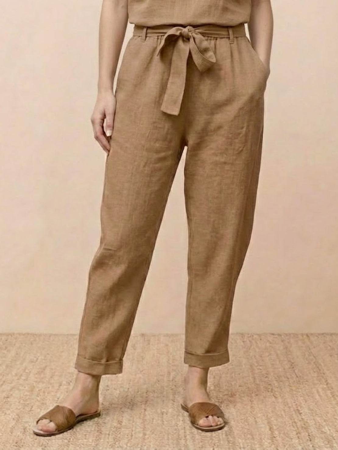Cotton linen monochrome straight-leg pants with adjustable drawstring waist and breathable fabric texture