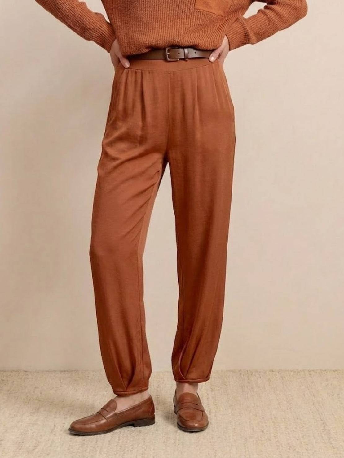 European Minimalism relaxed knit sweater top and trouser set in warm brown tones with casual shoes