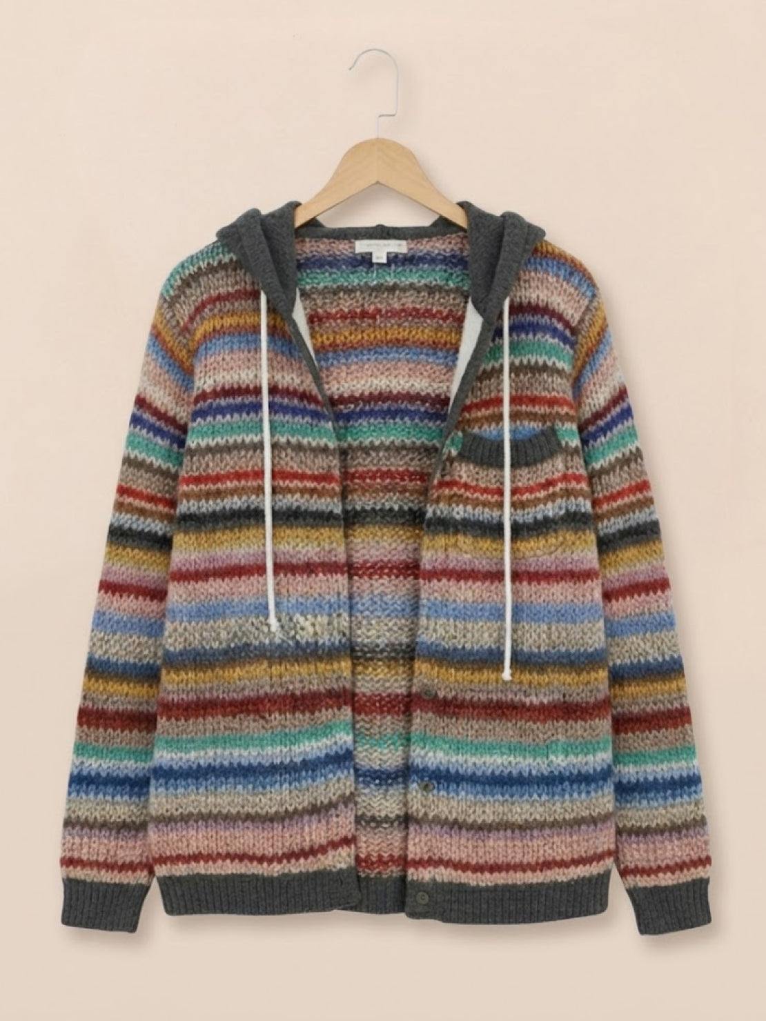 Woman wearing Highland Plaid Shacket with hood and button-front in autumn setting