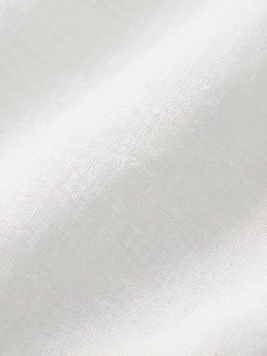 woman wearing loose solid color two-piece set with round-neck pullover and wide-leg pants