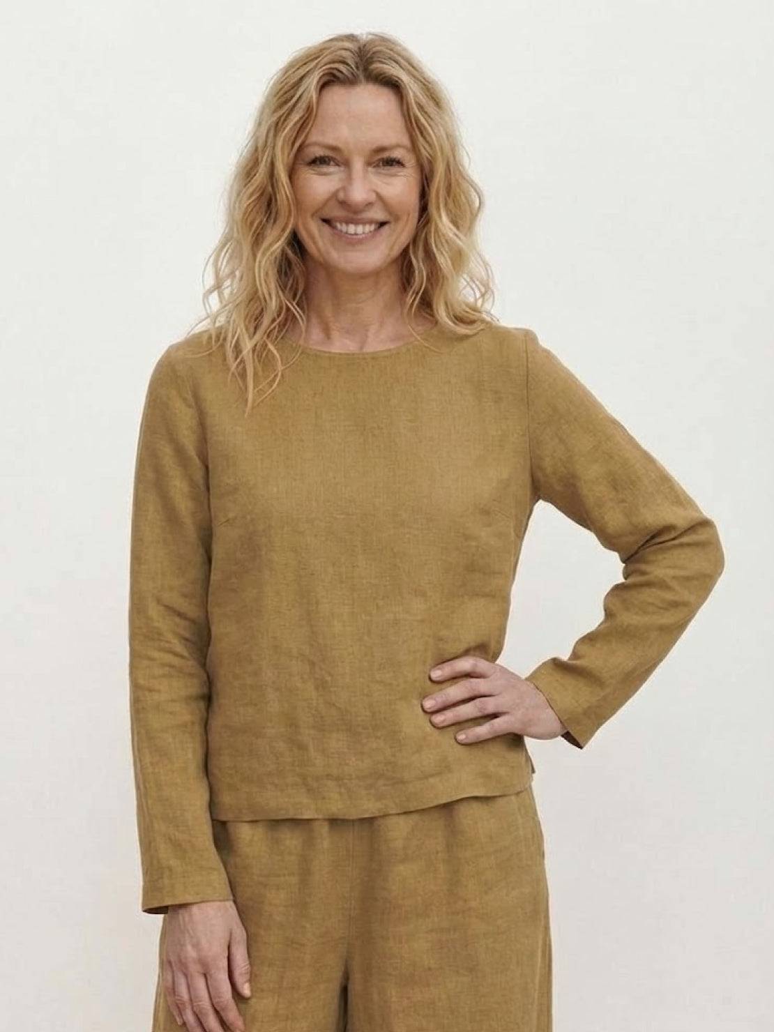 woman wearing loose solid color two-piece set with round-neck top and wide-leg pants