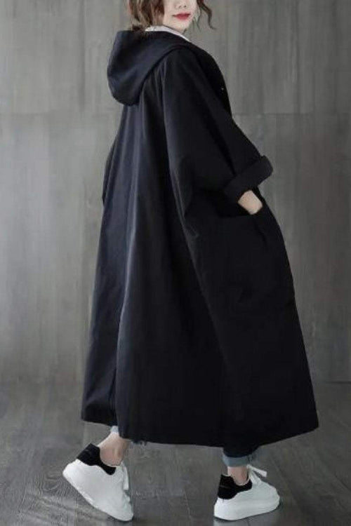 Oversized black waterproof windbreaker jacket with hood and large pockets, lightweight and longline design