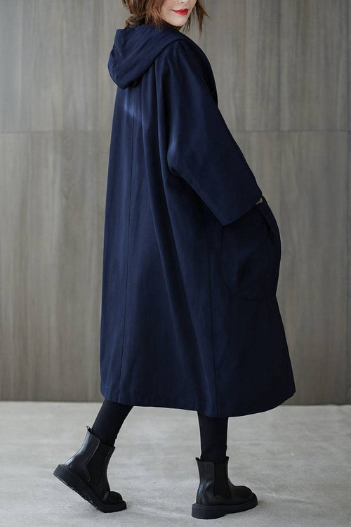 Oversized navy water resistant windbreaker jacket with hood and longline design for women