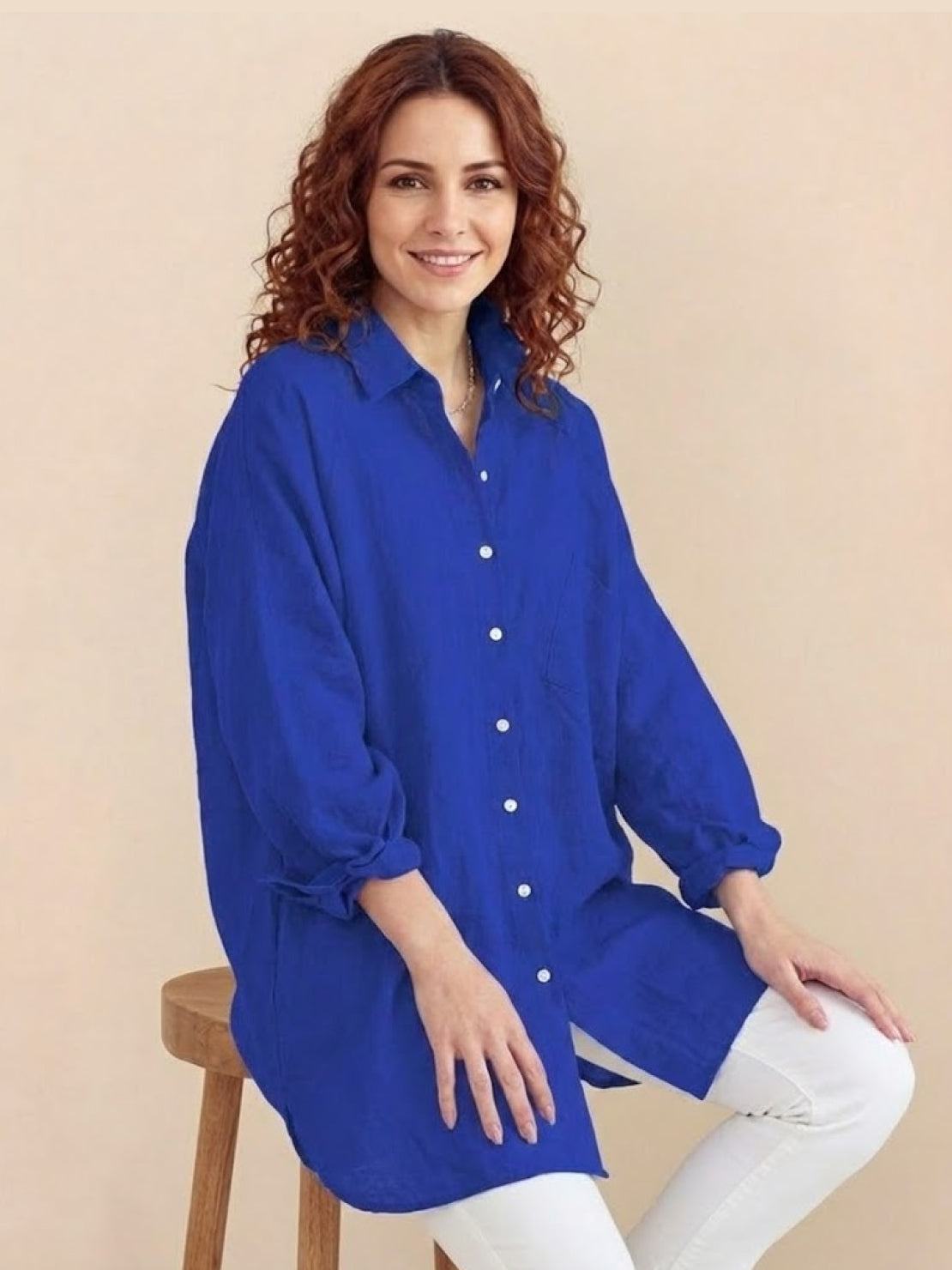 Oversized linen shirt with breathable cotton blend and relaxed fit showcasing back gathers and buttons