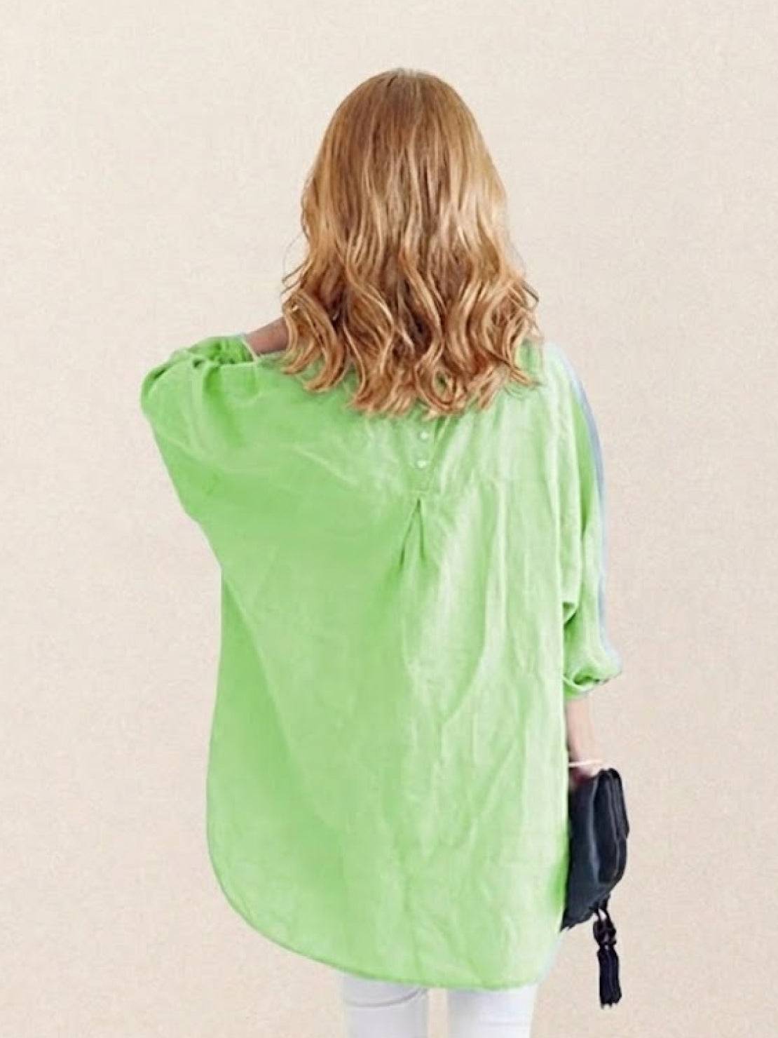 Oversized linen shirt in soft white cotton-linen blend with relaxed fit and back button detailing