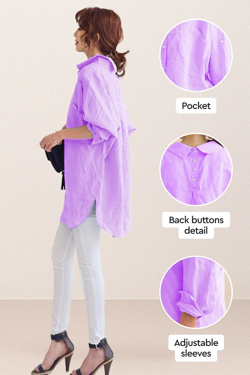 Oversized linen shirt in lavender with back button detail, adjustable sleeves, and pocket, styled with white pants and heels.