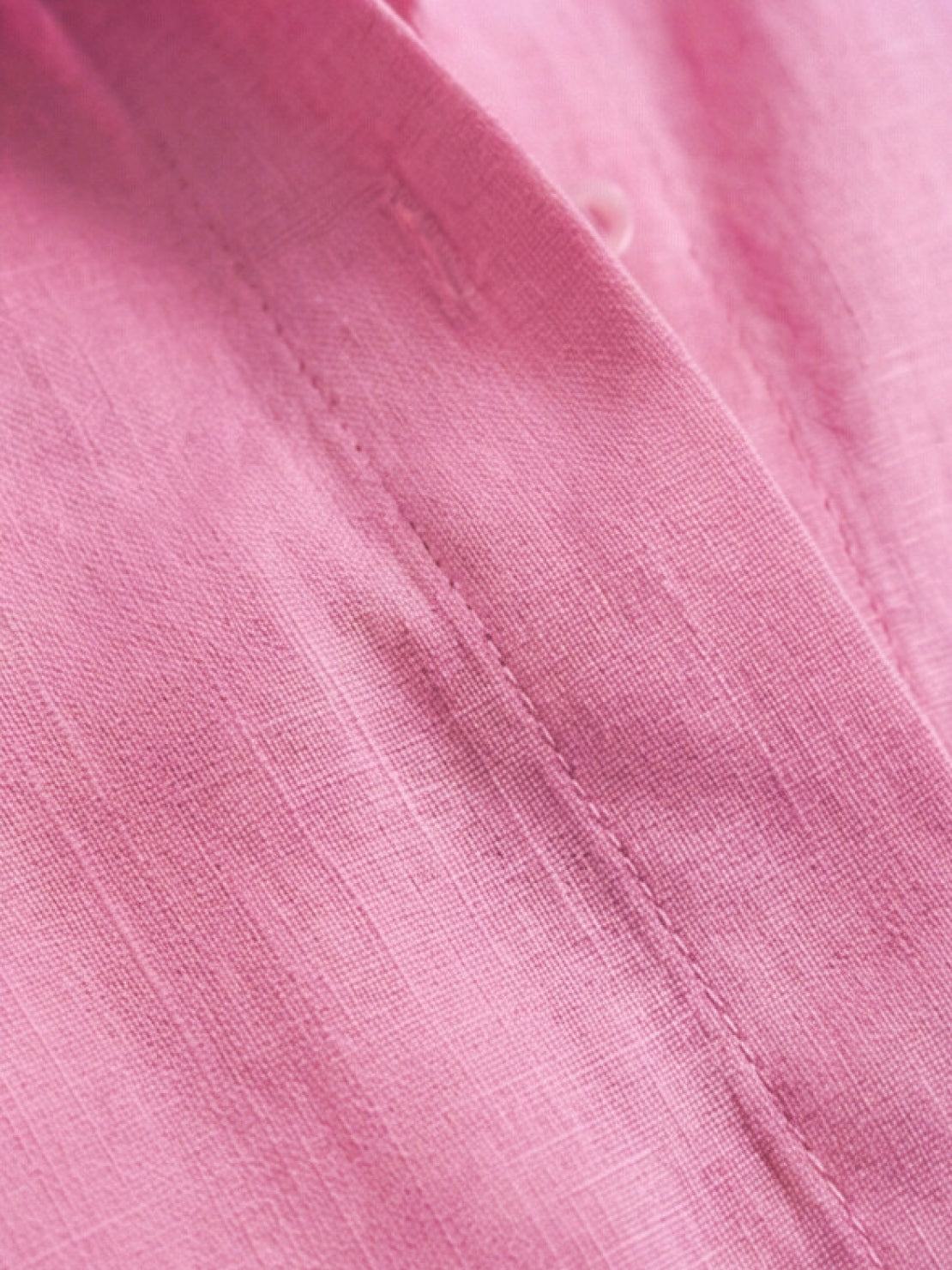 Model wearing oversized 100% cotton shirt and wide-leg pants co-ord set in relaxed white style