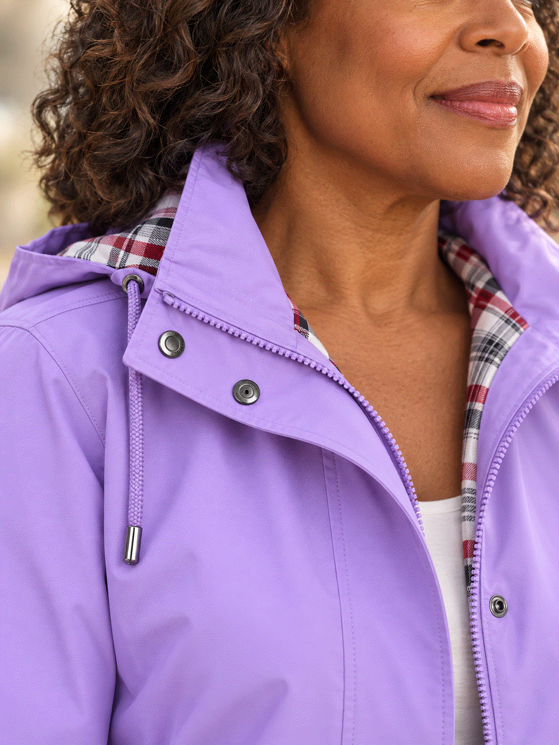 women's plaid-lined hooded rain jacket with waterproof shell and drawstring waist