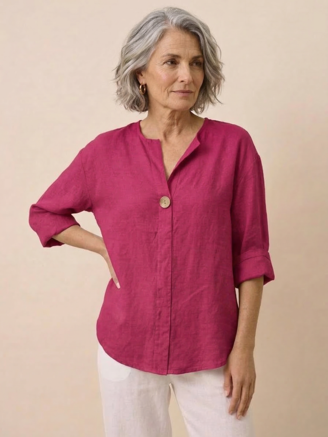 woman wearing pure linen age-defying button detail shirt in white standing outdoors