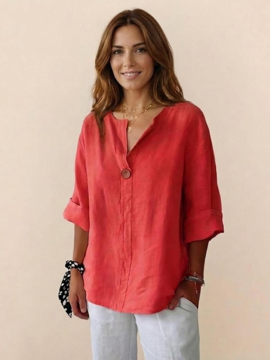 White pure linen age-defying shirt with button detail on hanger against white background