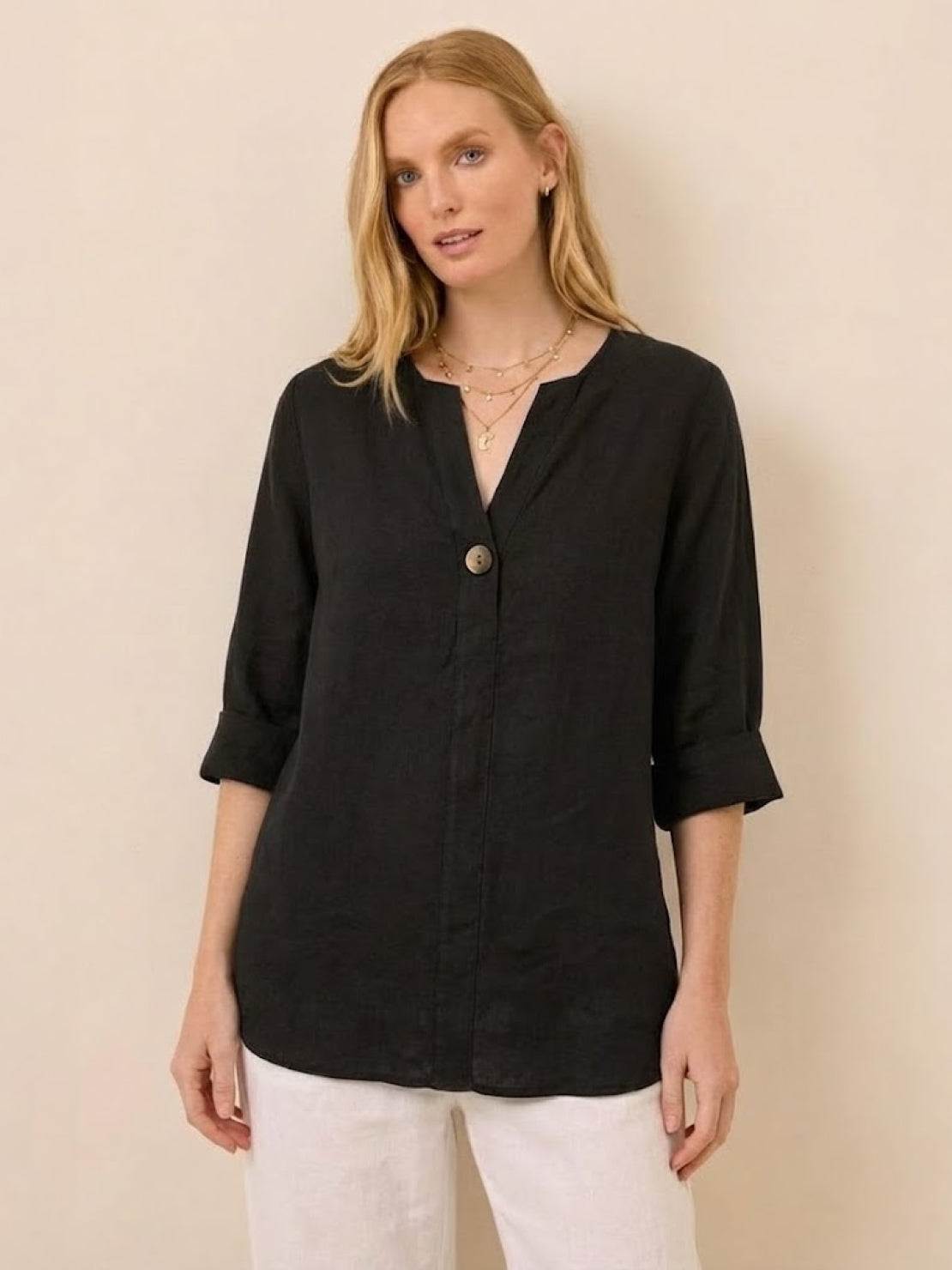 Black pure linen age-defying shirt with button detail worn by woman