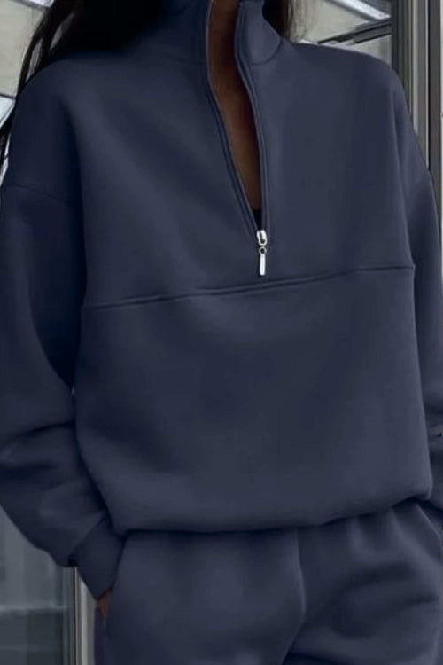 Navy cotton blend tracksuit with high collar, deep zipper, and relaxed fit for casual comfort and style