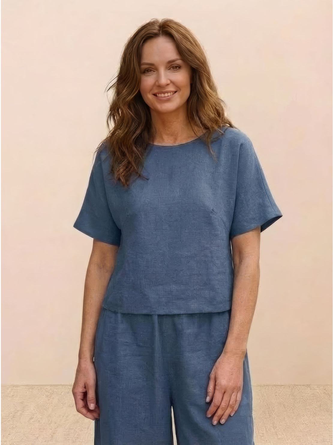 Woman wearing blue loose fit co-ord set with short sleeves and wide-leg trousers, comfortable and relaxed style