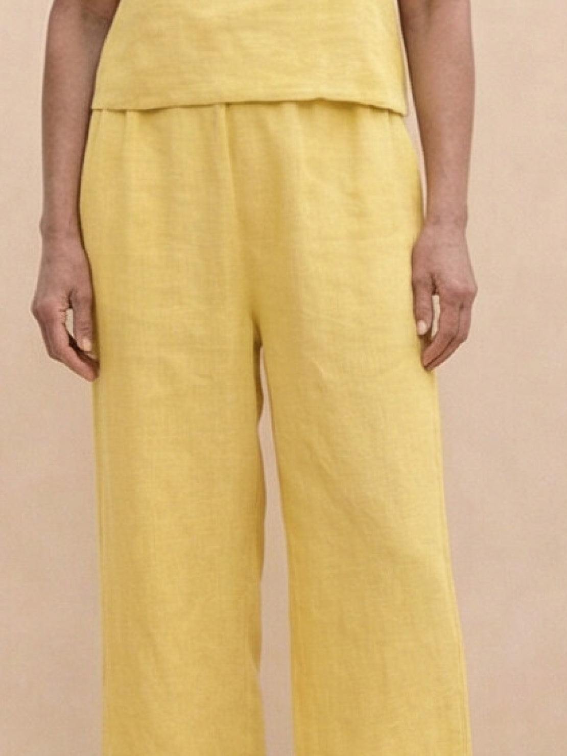 woman wearing loose fit co-ord set with soft-tailored top and wide-leg bottoms in meadow design