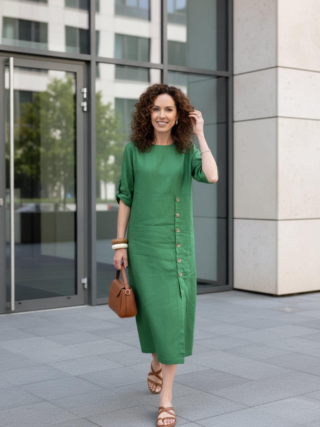 White pure cotton elegance dress hanging against a wooden background