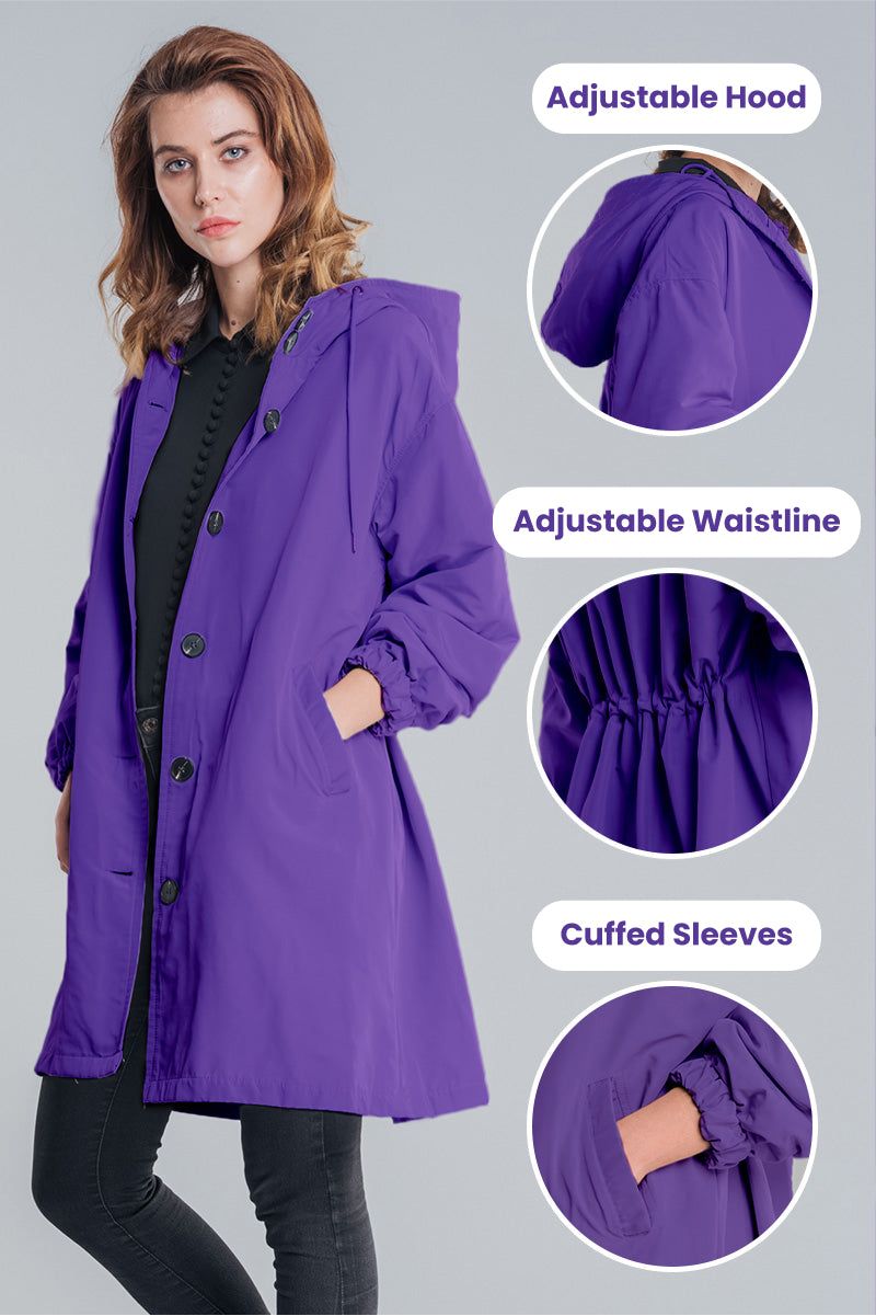 Woman wearing purple Rain Couture Windbreaker with adjustable hood, waistband, and cuffed sleeves, showcasing trendy oversized water-resistant jacket.