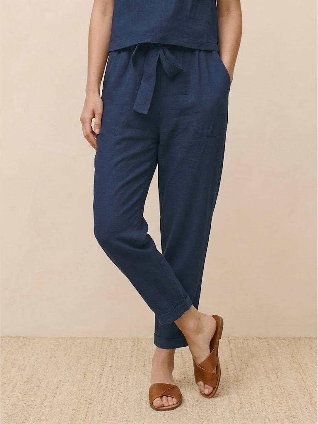 Cotton linen monochrome straight-leg pants with adjustable drawstring waist and breathable textured fabric