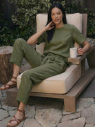 Woman wearing breathable 100% cotton linen monochrome set with relaxed short-sleeve top and straight-leg pants