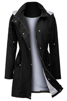Women's black water resistant hooded striped windbreaker rain jacket with oversized fit and multiple pockets