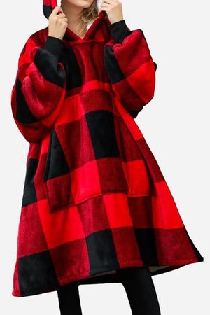 Snuggly oversized hooded fleece sweater in red and black plaid with a large front pocket and cozy hood