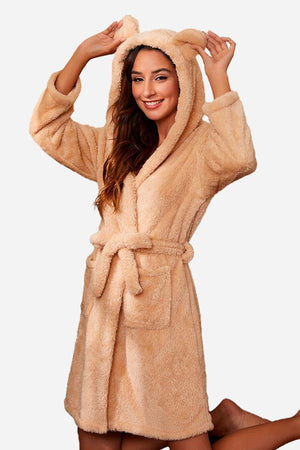 Woman wearing beige premium comfort nightgown bathrobe with hood and ears, belted waist, and front pockets