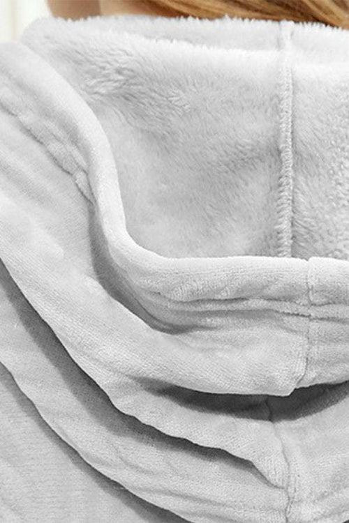 Close-up of soft, thick hood detail of stylish flannel nightgown in cozy white fabric