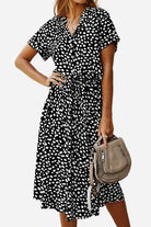 Casual bohemian dress skirt with black and white dot print, lace-up waist, short sleeves, and midi length.