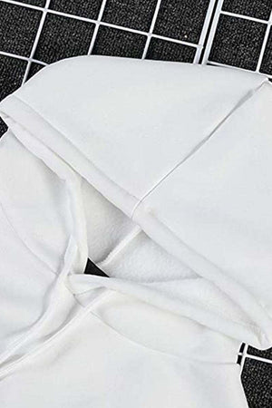 White oversized graffiti rose hoodie with cozy loose fit and long sleeves on grid background