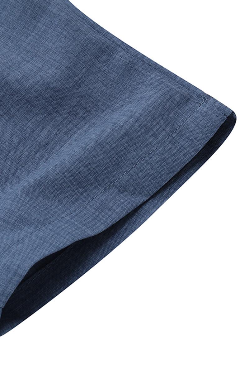 Close-up of blue high-waist wrapped pants fabric and hem detail